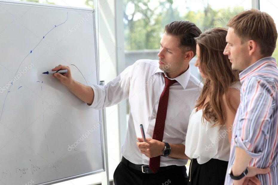 Leader Explaining Something On Whiteboard Stock Photo Opolja 12858896